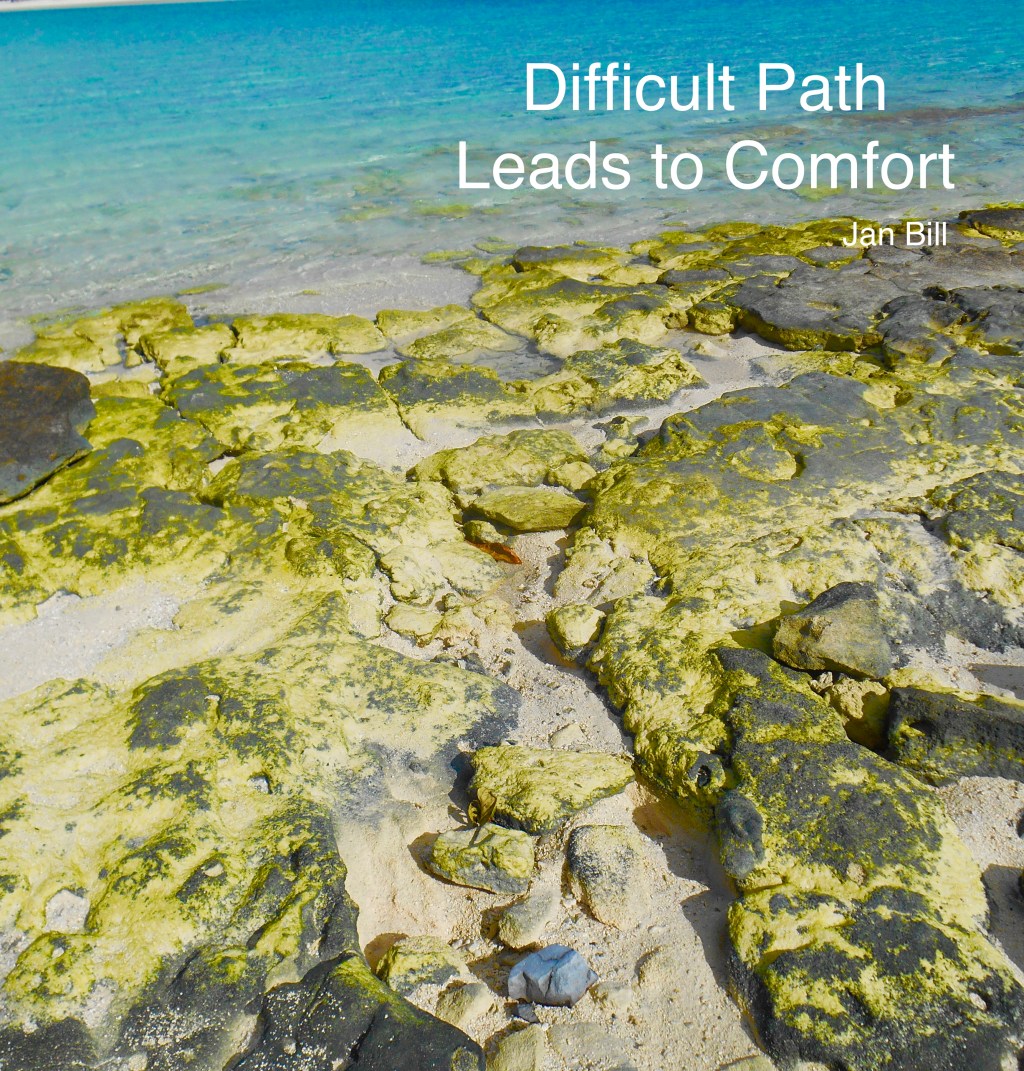 image of yellow rocks in the ocean in Tahiti